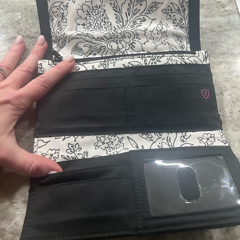 Vera Bradley black quilted wallet.
Barely used.
8”wide x 5” - Picture 2 of 4